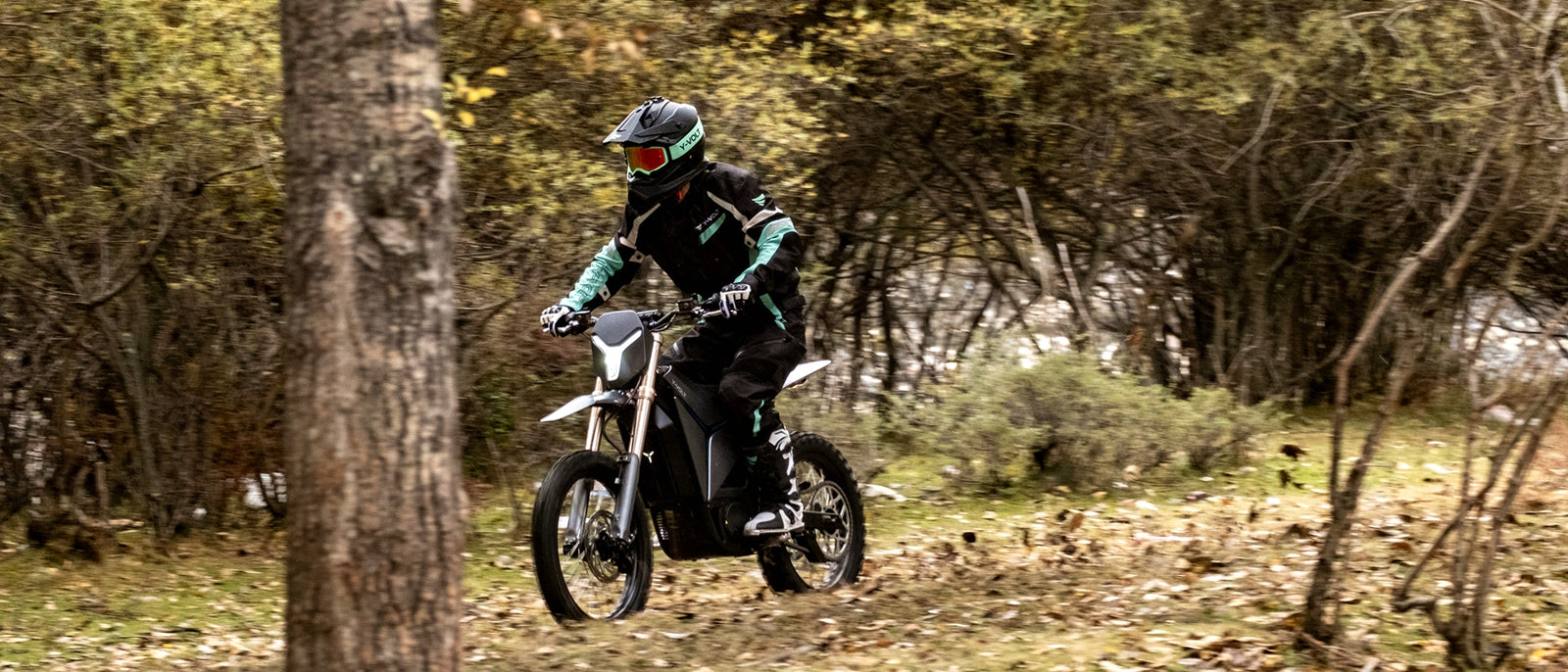 Rider on the Surge V through an autumn forest
